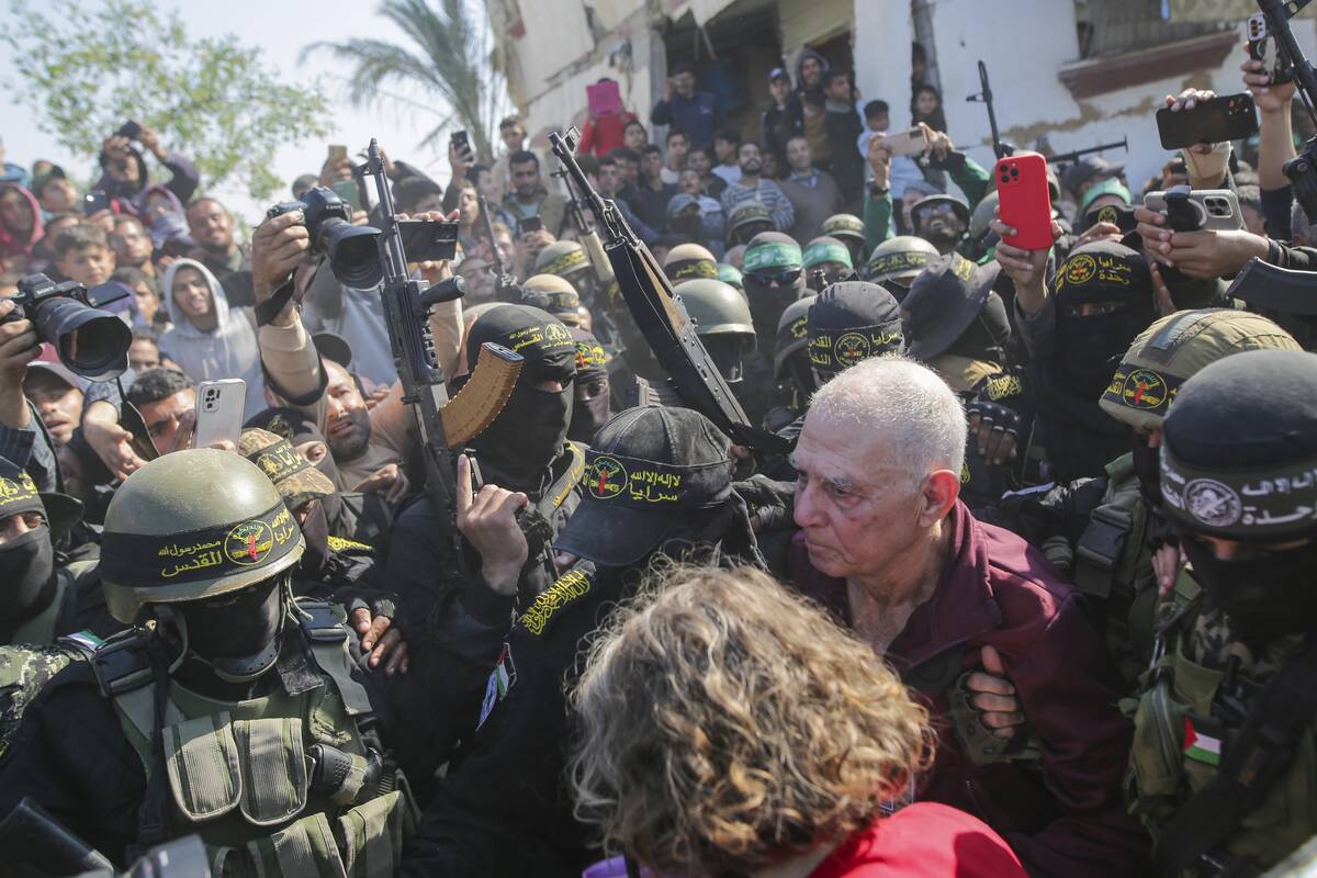 Gadi Moses, 80, center right, who has been held hostage by Hamas in Gaza since October 7, 2023, ...
