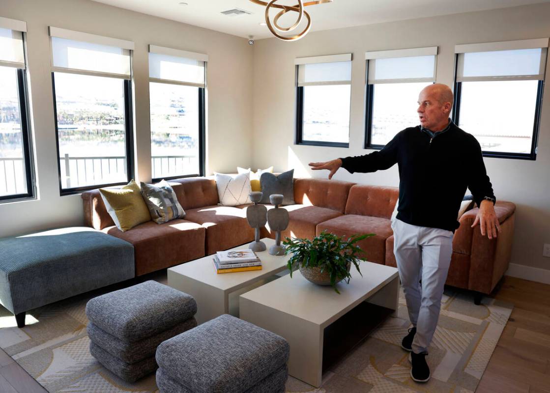 Klif Andrews, division president of Tri Pointe Homes Las Vegas, leads a tour of one of La Cova' ...