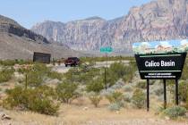 Motorists and bicyclists travel on State Route 159 near Calico Basin Road in the Red Rock Canyo ...