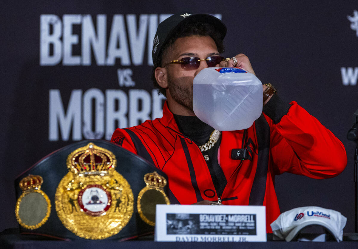 WBA light heavyweight champion David Morrell Jr. keeps hydrated during a press conference for S ...