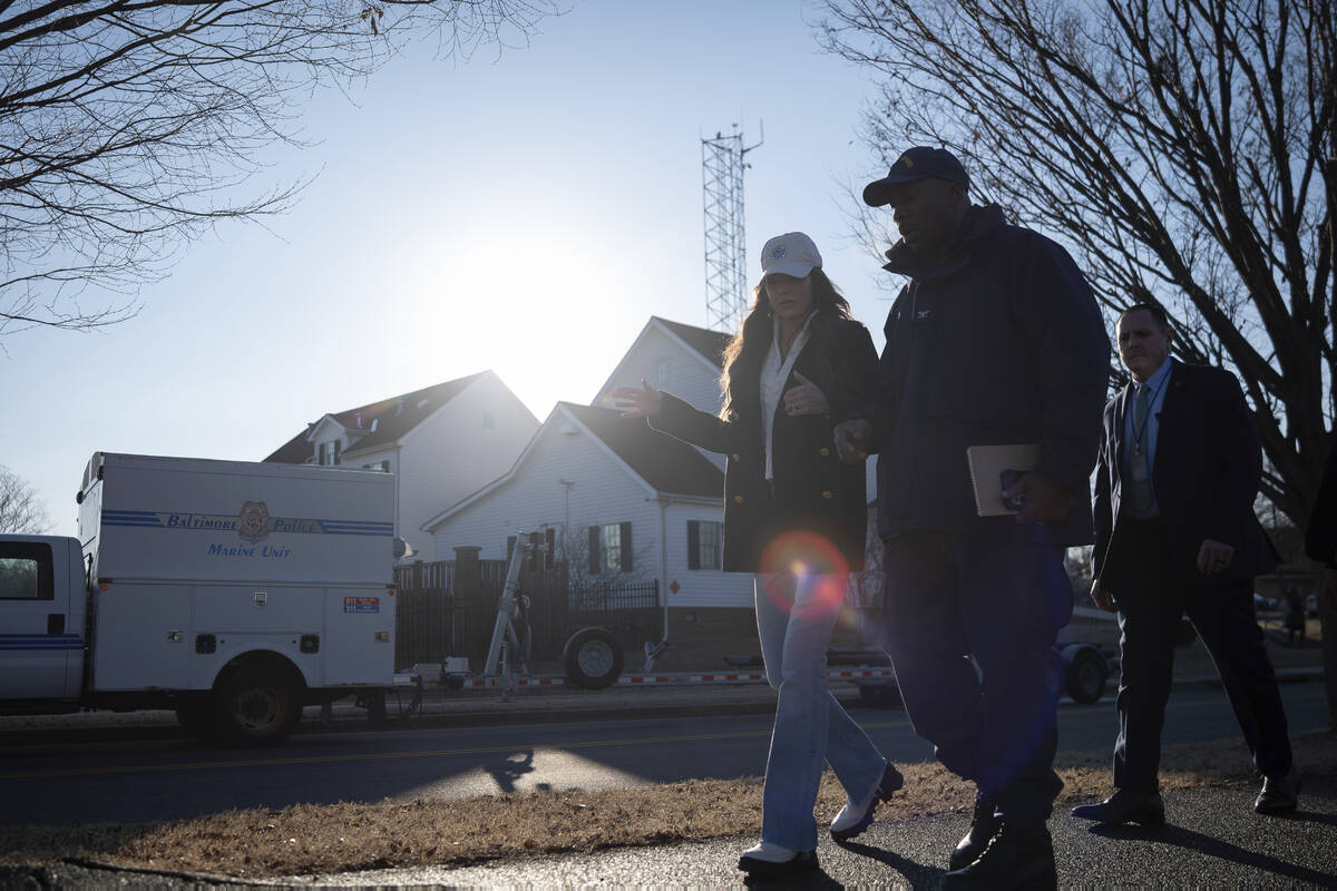 In this image provided by the U.S. Coast Guard, Secretary of Homeland Security Kristi Noem disc ...