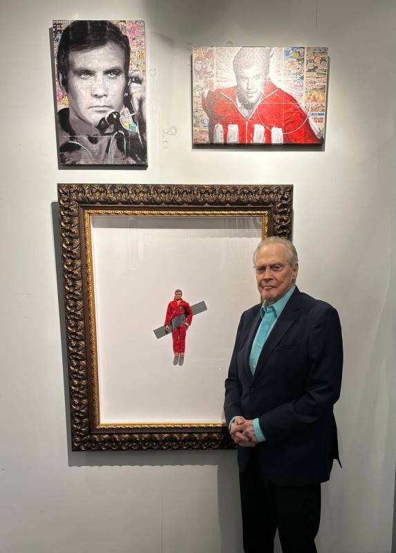 Lee Majors poses with portraits of himself and "Six Million Dollar Man With Banana" at Animazin ...