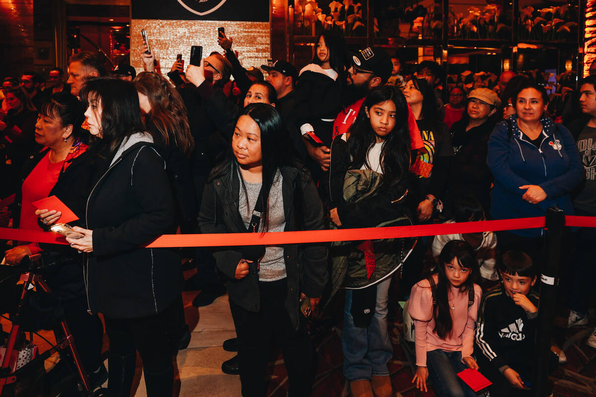 Crowds watch during a Lunar New Year parade featuring traditional dances at M Resort Spa Casino ...