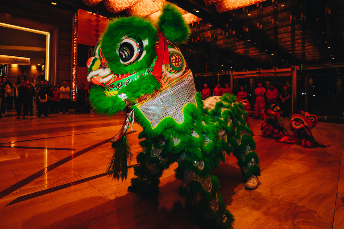 A dancing lion is seen during a Lunar New Year parade featuring traditional dances at M Resort ...