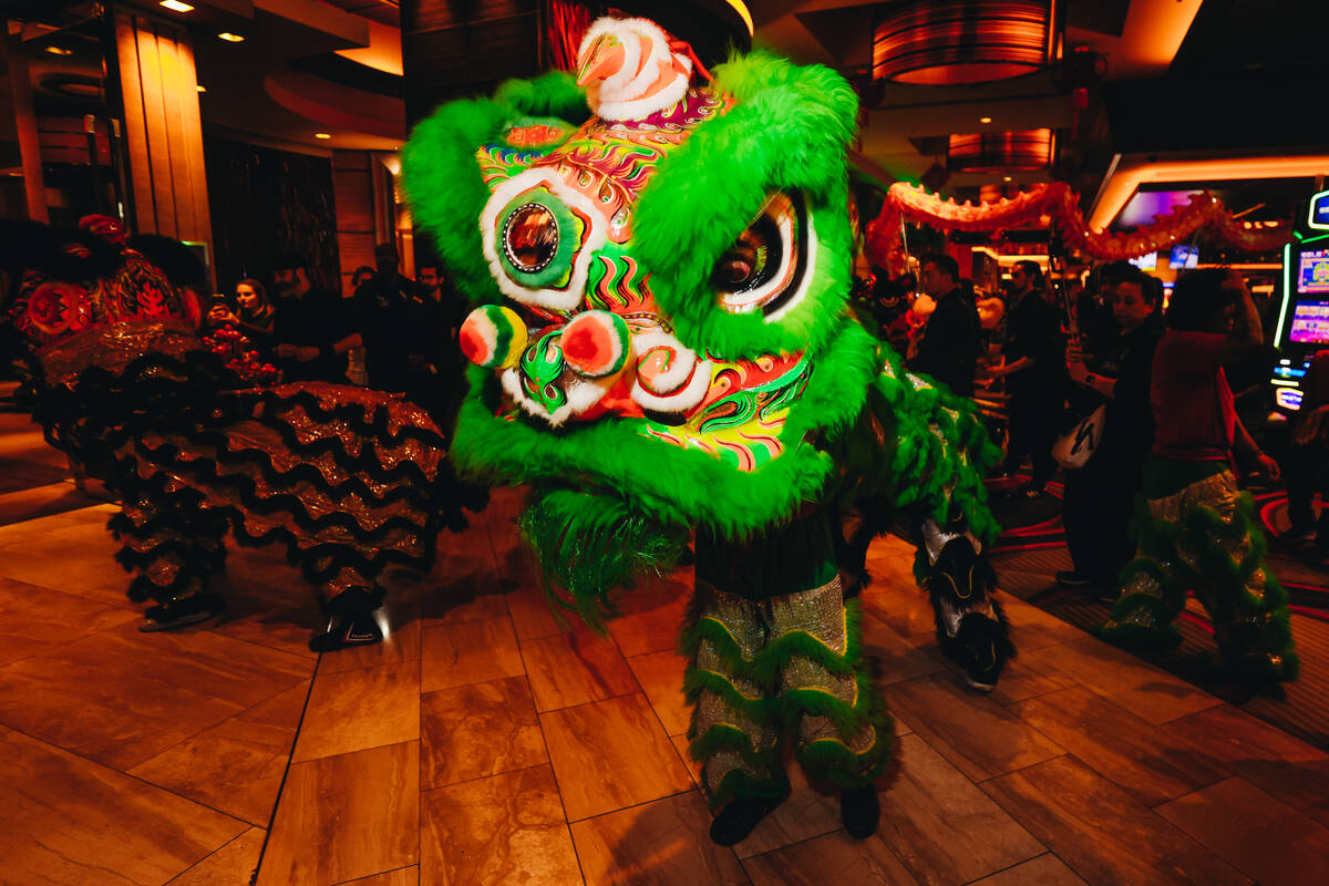 Dancing lions perform during a Lunar New Year parade featuring traditional dances at M Resort S ...
