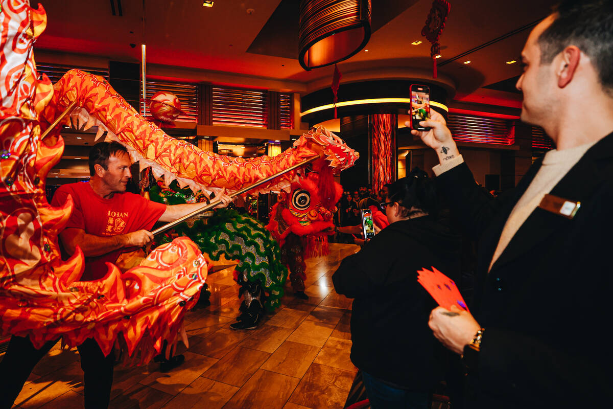 A dancing dragon performs during a Lunar New Year parade featuring traditional dances at M Reso ...