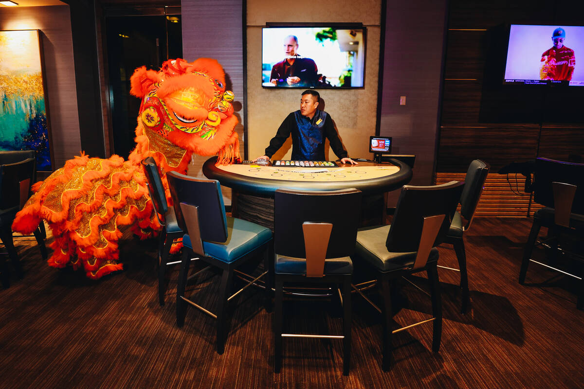 A dancing lion visits the high roller room during a Lunar New Year parade featuring traditional ...