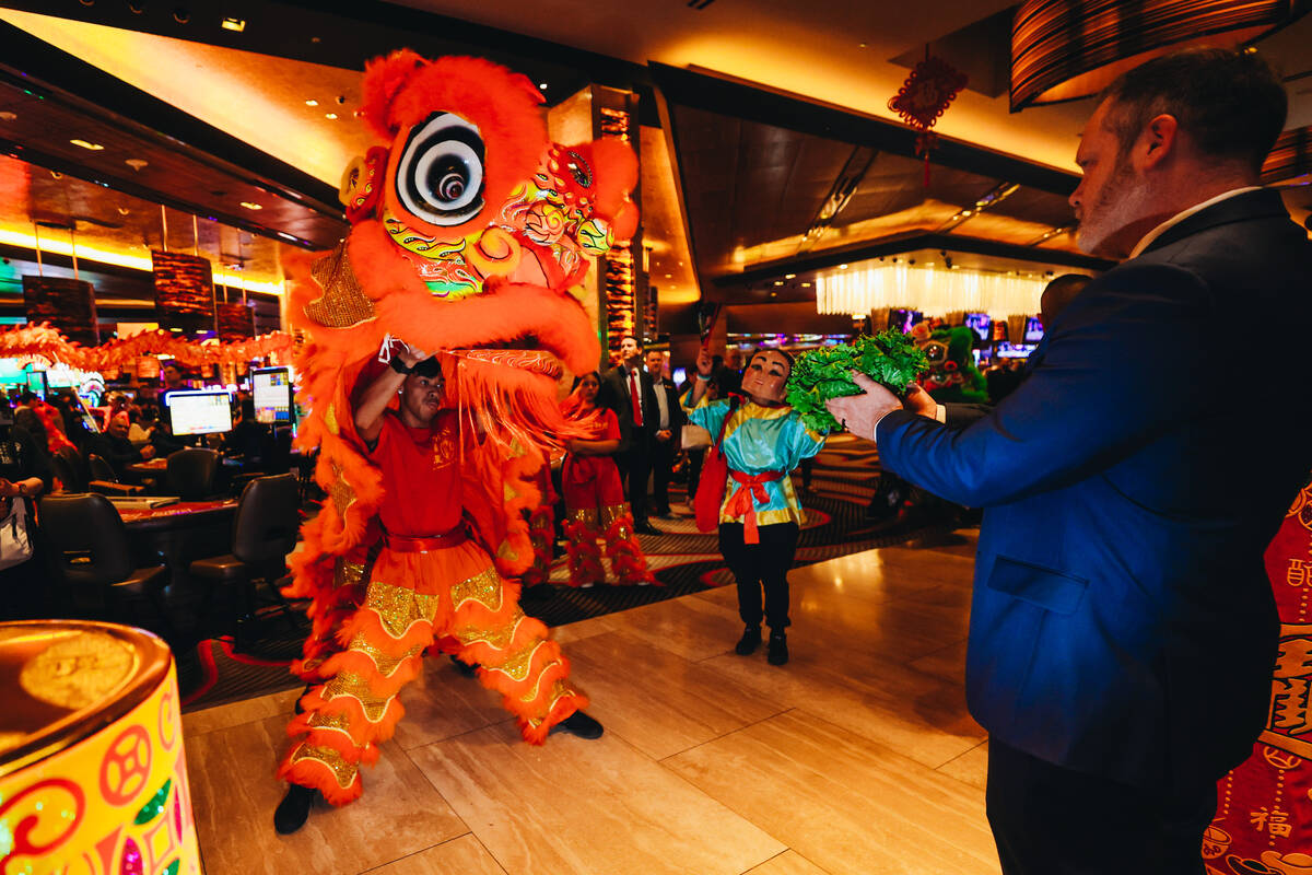 A dancing dragon performs during a Lunar New Year parade featuring traditional dances at M Reso ...