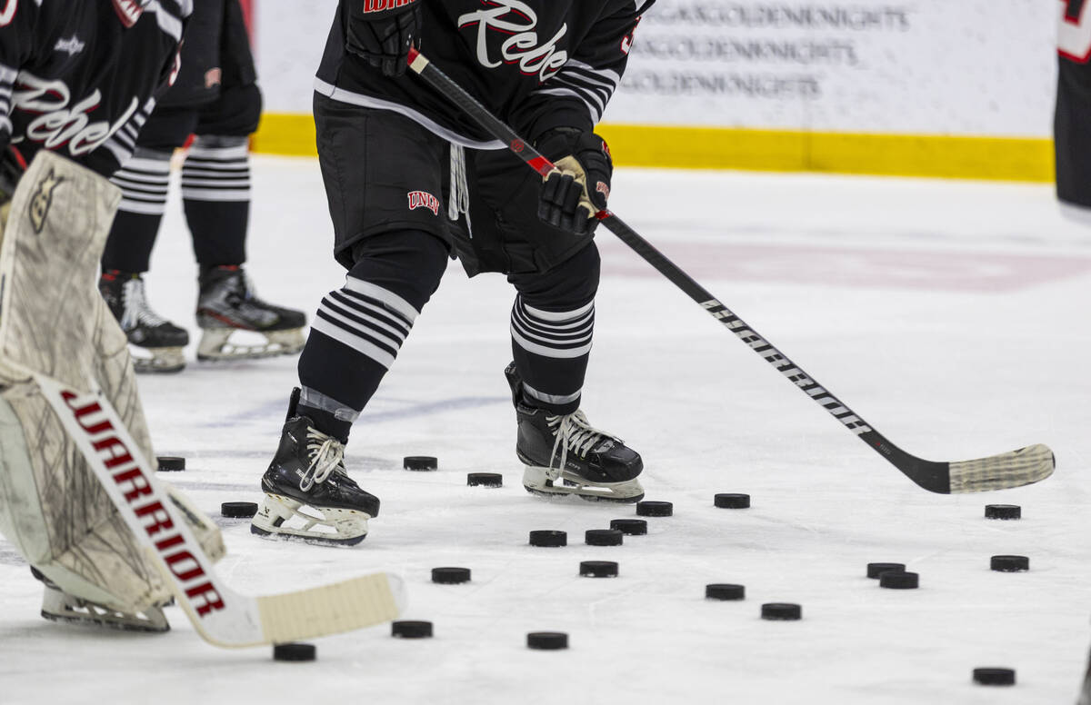 UNLV players warm up before the club hockey team faces the Jamestown Jimmies during their game ...