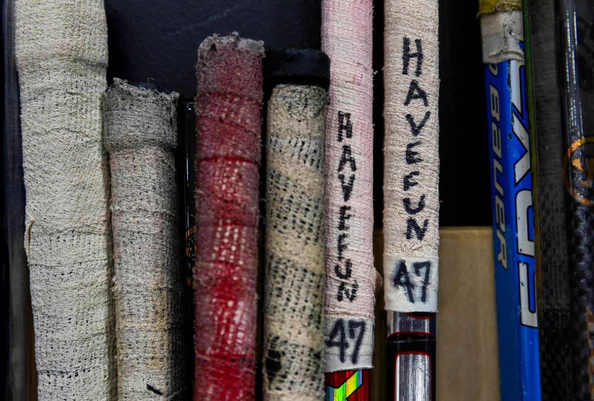 UNLV forward Ronan Keenan (47) marks his sticks with "have fun" as the club hockey te ...