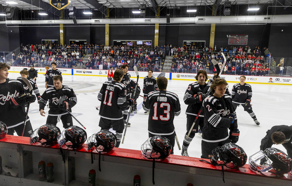 UNLV players head to their helmets on the rail before the club hockey team faces the Jamestown ...