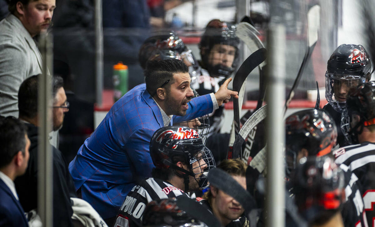 UNLV head coach Anthony Vignieri-Greener cousels his players on the bench as the club hockey te ...