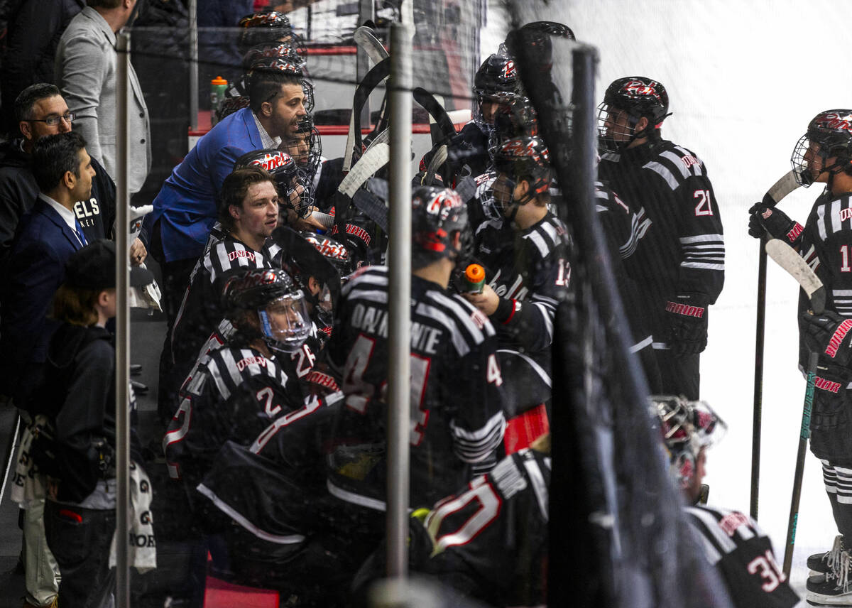 UNLV head coach Anthony Vignieri-Greener cousels his players on the bench as the club hockey te ...