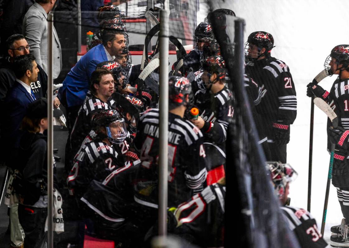 UNLV head coach Anthony Vignieri-Greener cousels his players on the bench as the club hockey te ...