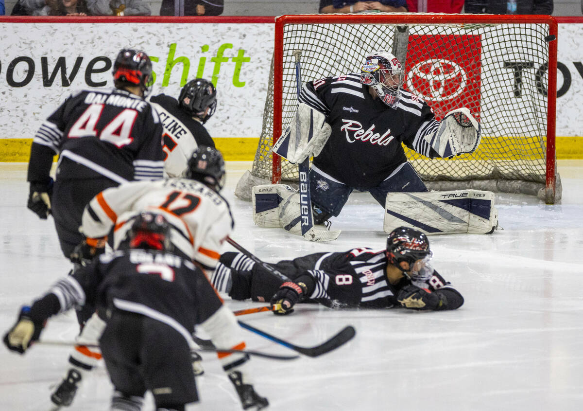 UNLV goalie Jeremy Forman (31) deflects a shot off his glove to the post for a near score by th ...