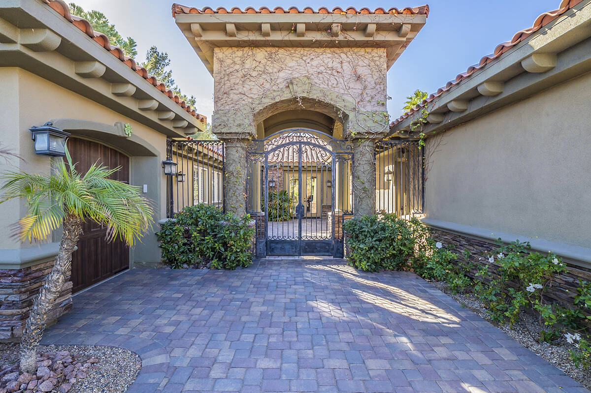 This newly listed custom, single-story home in the SouthShore community at Lake Las Vegas is be ...