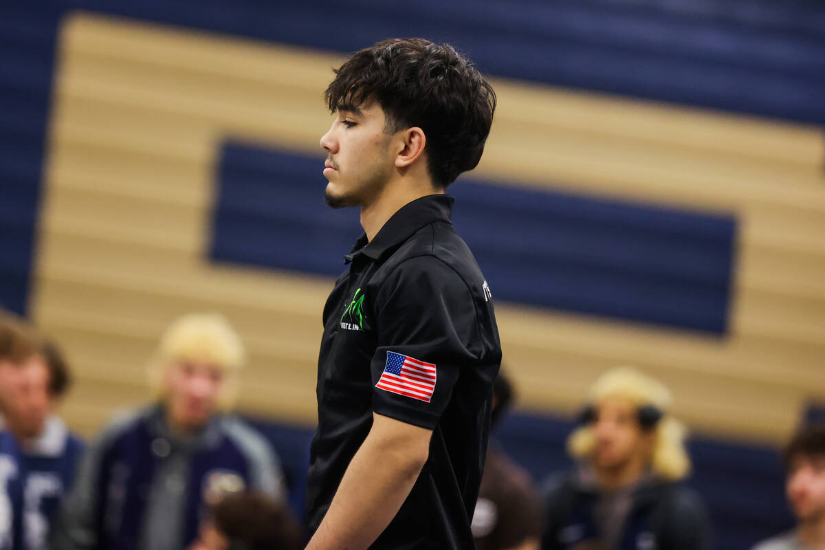 SLAM academy’s Manuel Saldate walks up to receiver his gold medal in the 138 weight cate ...