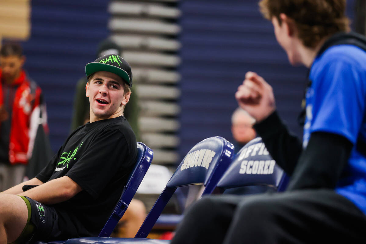 SLAM Academy wrestler Isaac Balden waits to go up for his first place medal in the 150 pound di ...