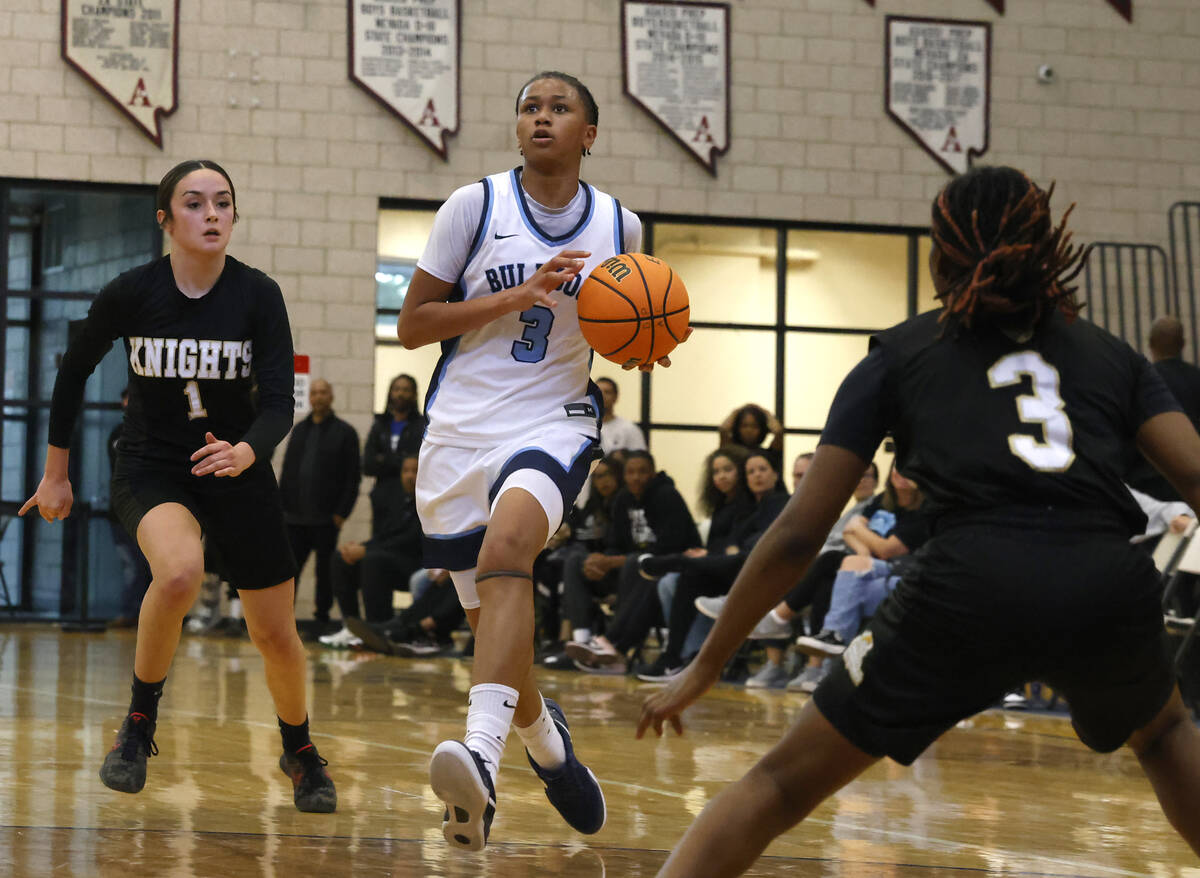 Centennial's D'Arrah Mitchell (3) runs down the court as Democracy Prep's Madison Smith (1) and ...
