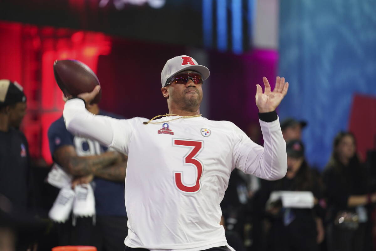 AFC quarterback Russell Wilson (3) competes in Passing the Test during the Skills Competition, ...