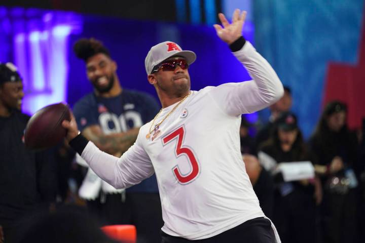AFC quarterback Russell Wilson (3) competes in Passing the Test during the Skills Competition, ...