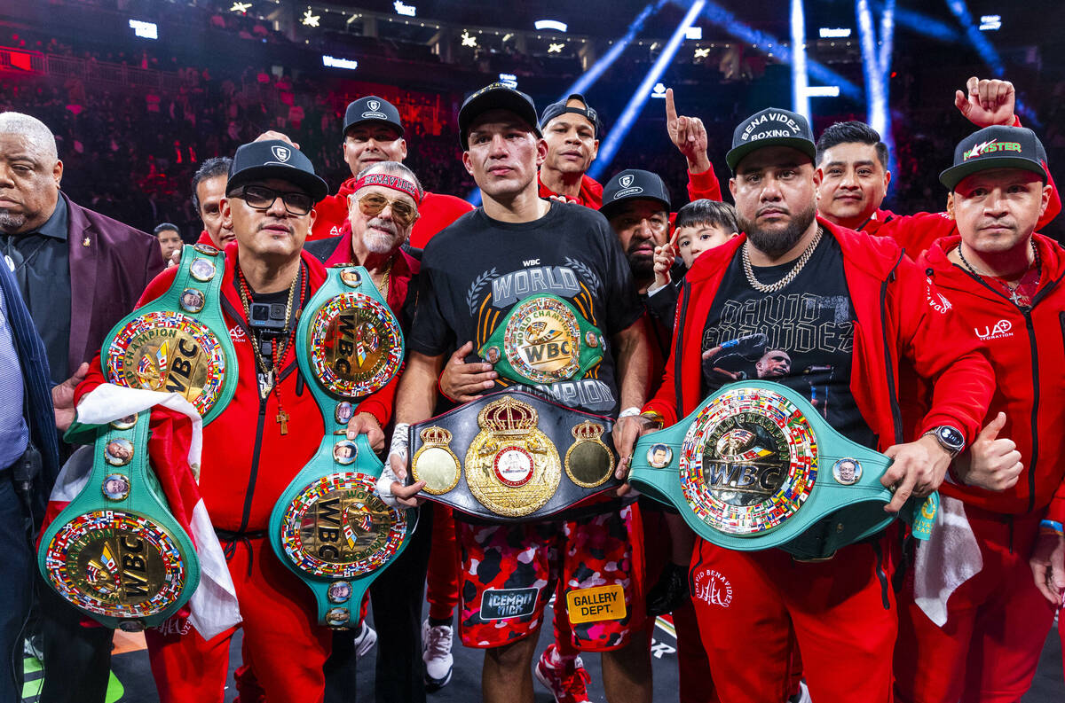 David Benavidez and his team celebrate their win over David Morrell Jr. after 12 rounds of thei ...