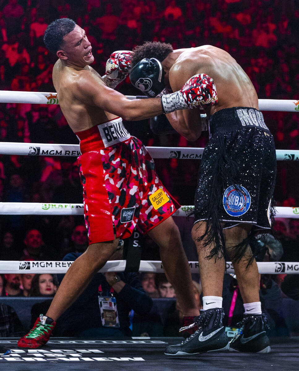 David Benavidez gets a shot into the body of David Morrell Jr. in round 3 of their WBC and WBA ...
