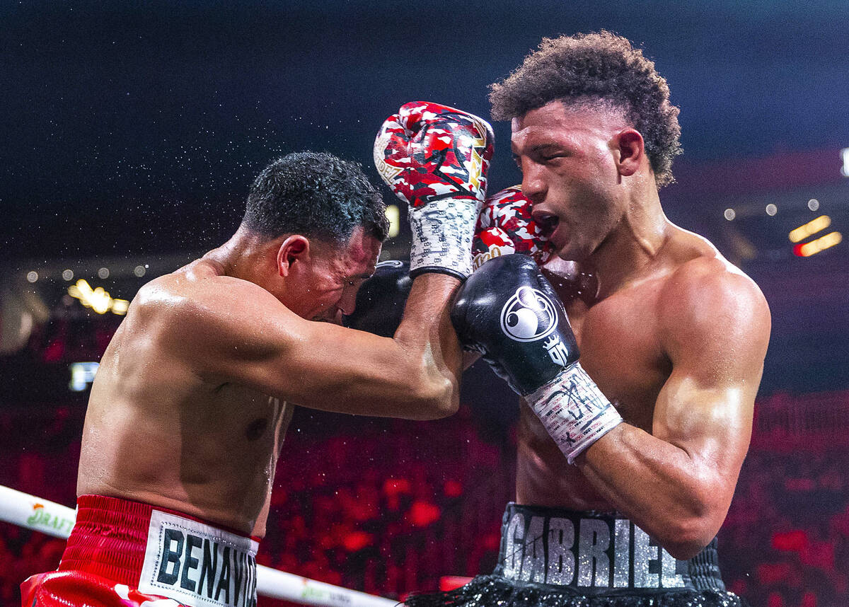 David Benavidez and David Morrell Jr. trade punches in round 10 of their WBC and WBA title figh ...