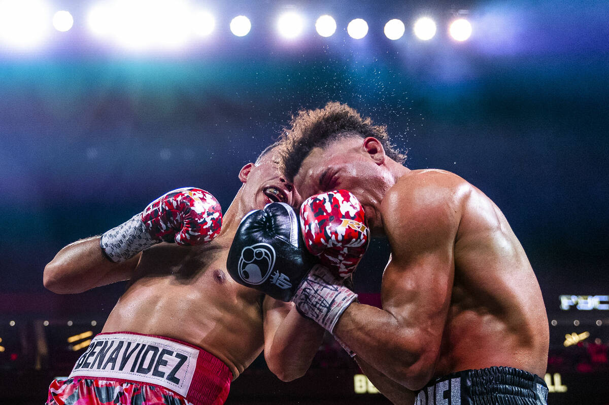 David Benavidez connects with an uppercut on David Morrell Jr. in round 12 of their WBC and WBA ...