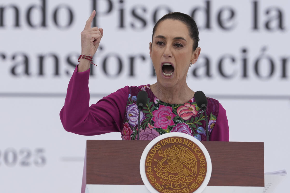 FILE - President Claudia Sheinbaum speaks to the crowd during an event marking her first 100 da ...
