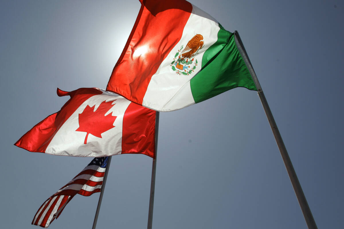 FILE - National flags representing the United States, Canada, and Mexico fly in the breeze in N ...