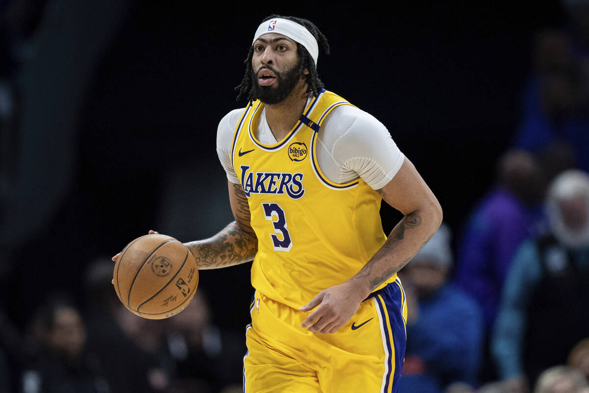 Los Angeles Lakers forward Anthony Davis brings the ball upcourt during the second half of an N ...
