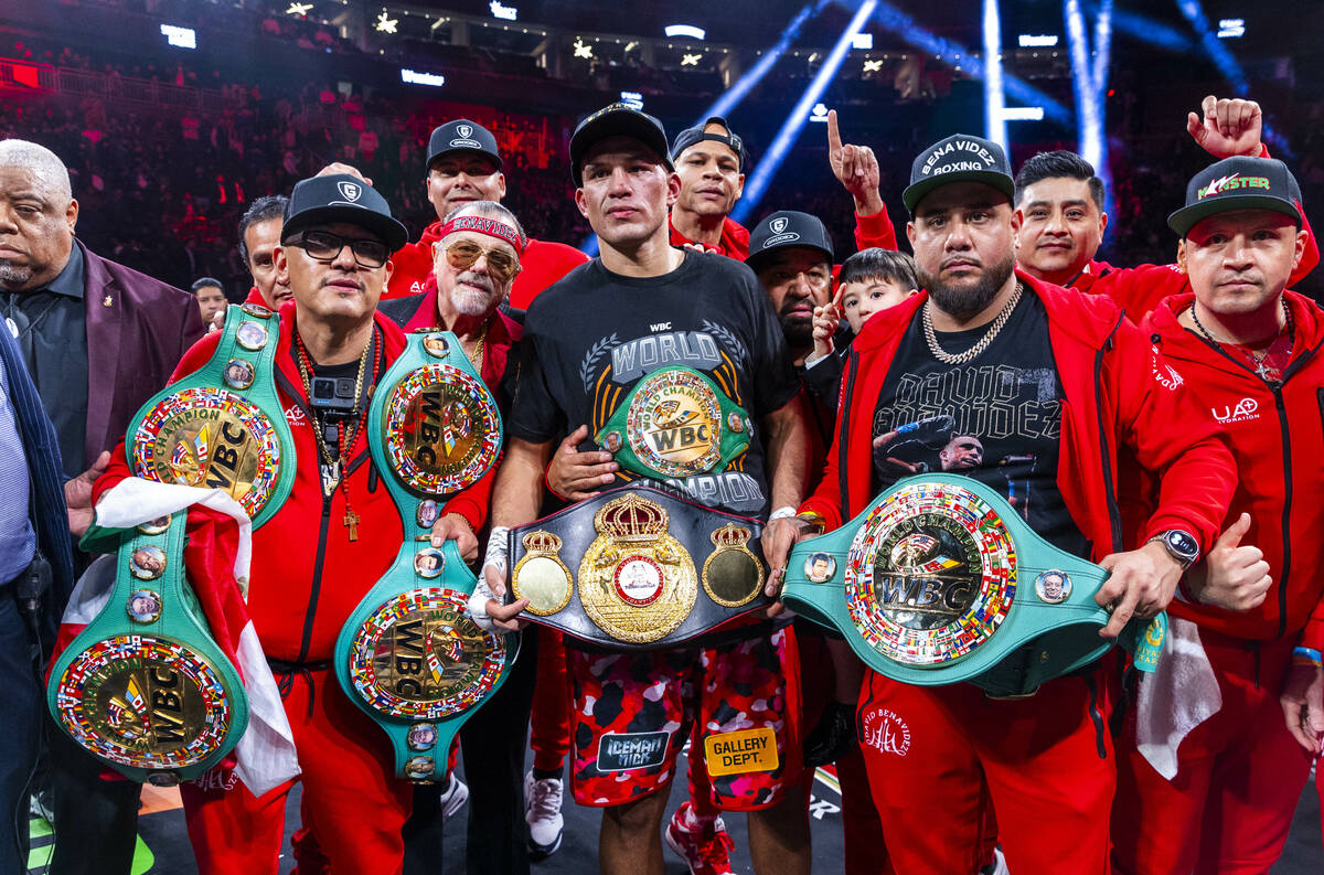 David Benavidez and his team celebrate their win over David Morrell Jr. after 12 rounds of thei ...