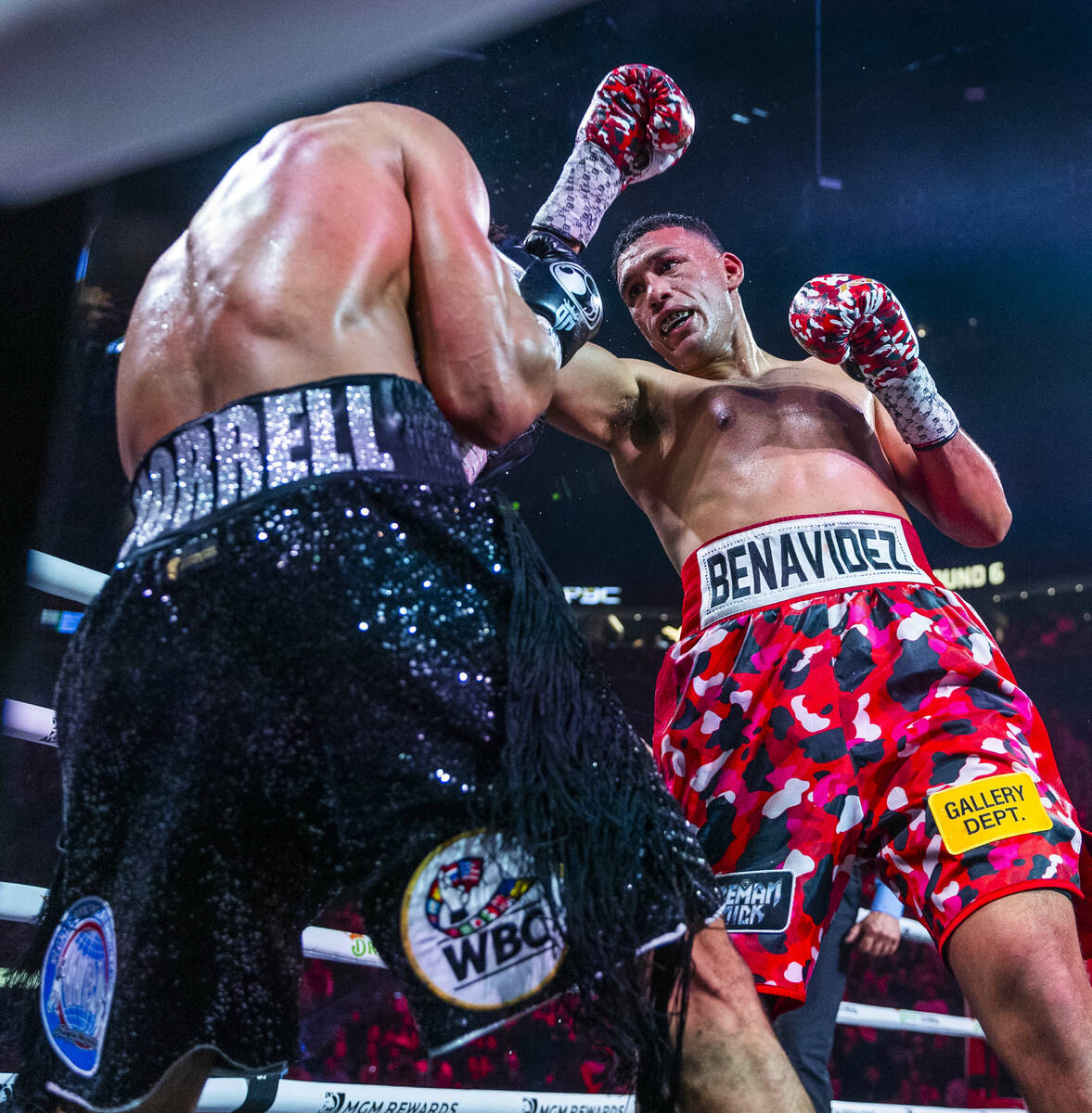 David Morrell Jr. is grazed by a punch from David Benavidez in round 6 of their WBC and WBA tit ...
