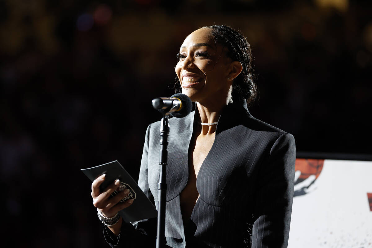 A'ja Wilson attends a ceremony to retire her number before an NCAA college basketball game betw ...