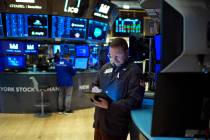 Traders work on the floor at the New York Stock Exchange in New York, Wednesday, Jan. 29, 2025. ...