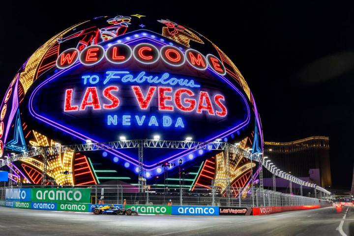 A race car navigates around the Sphere during the qualifying round for the Formula 1 Las Vegas ...