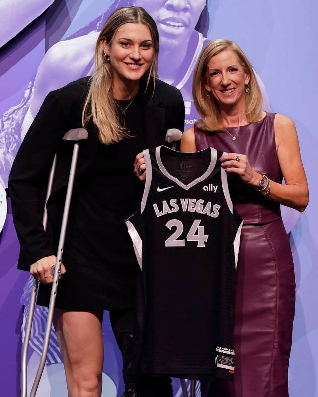 Virginia Tech's Elizabeth Kitley, left, poses for a photo with WNBA commissioner Cathy Engelber ...