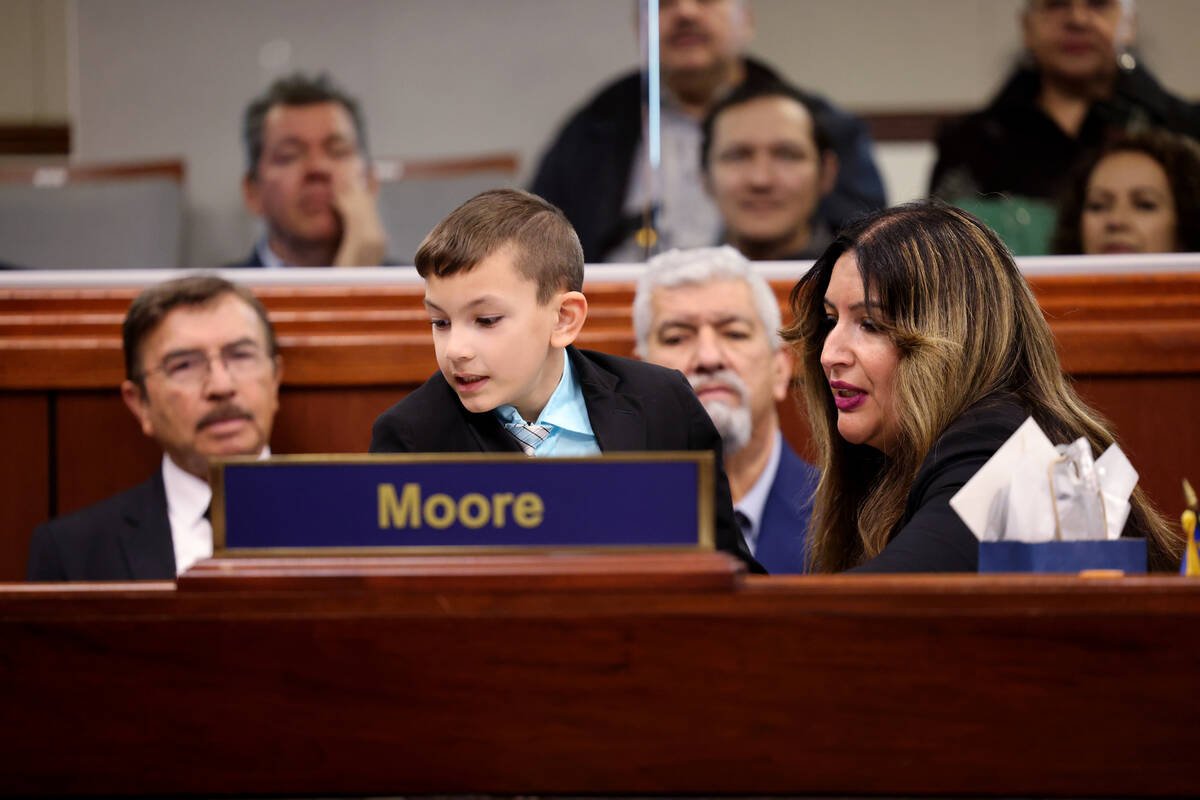 Assembly member Cinthia Zermeño Moore, D-Las Vegas, and her son Liam Moore, 7, check out h ...