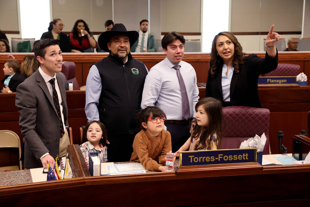 Assembly member Selena Torres-Fossett, D-Las Vegas, right, shows her family the Assembly chambe ...