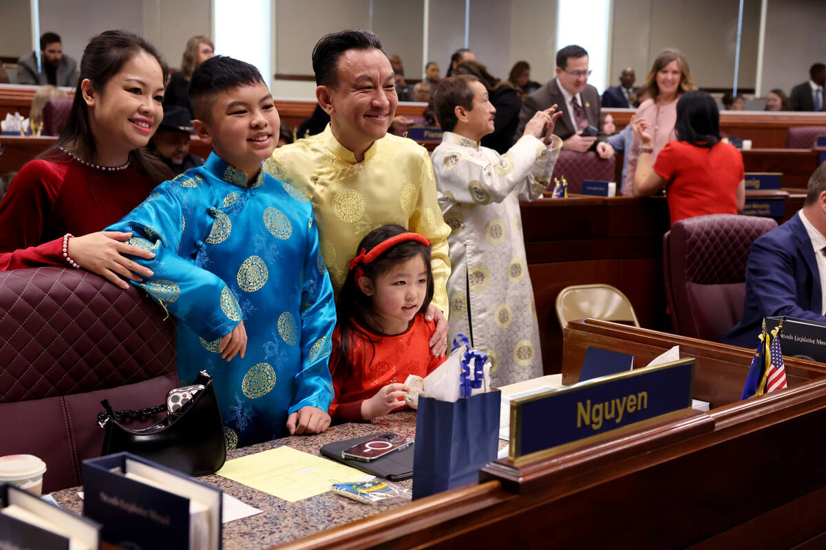 Assembly member Duy Nguyen, D-Las Vegas, right, poses with his wife Trang Le, and children Leso ...