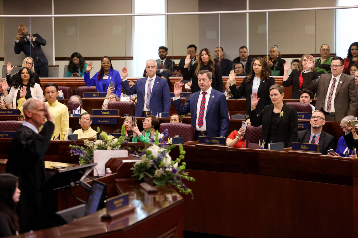 Assembly members take the oath of office on the Assembly floor in the Legislative Building in C ...