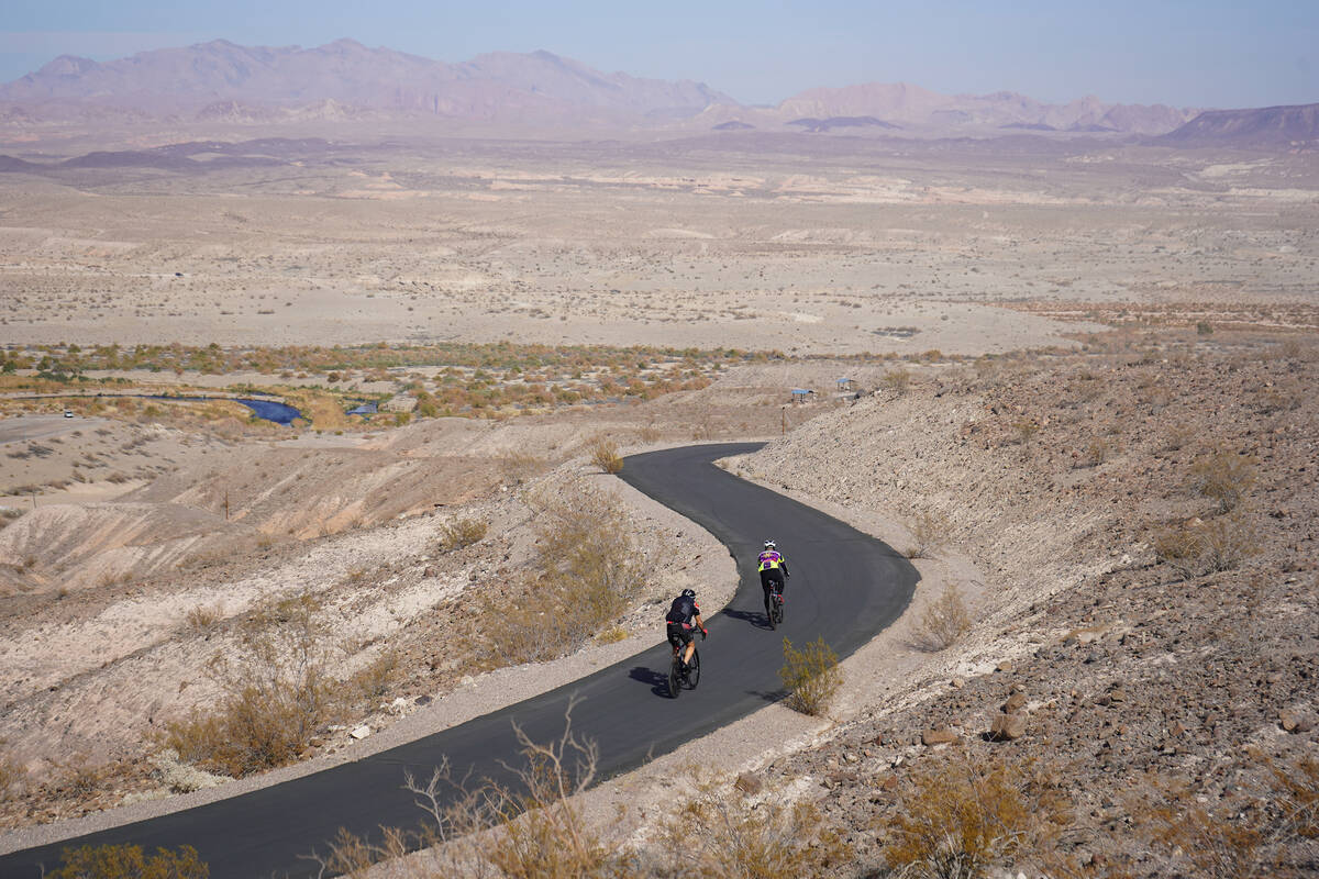 Bicyclists ride along a curvy stretch of River Mountains Loop Trail in Lake Mead National Recre ...
