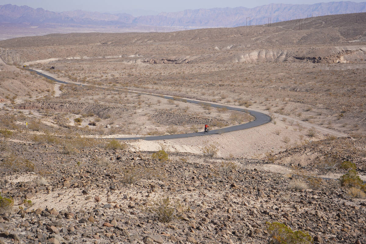 An e-bike rider follows the River Mountains Loop Trail in Lake Mead National Recreation Area on ...