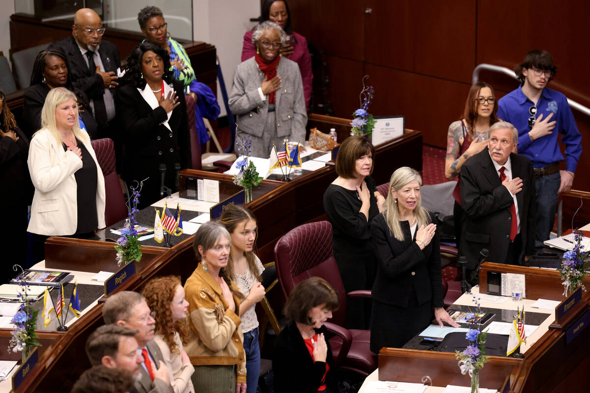 Senators and their guests recite the Pledge of Allegiance on the Senate floor in the Legislativ ...