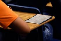 A cellphone pouch is display on Legacy High School student's desk during the first day of schoo ...