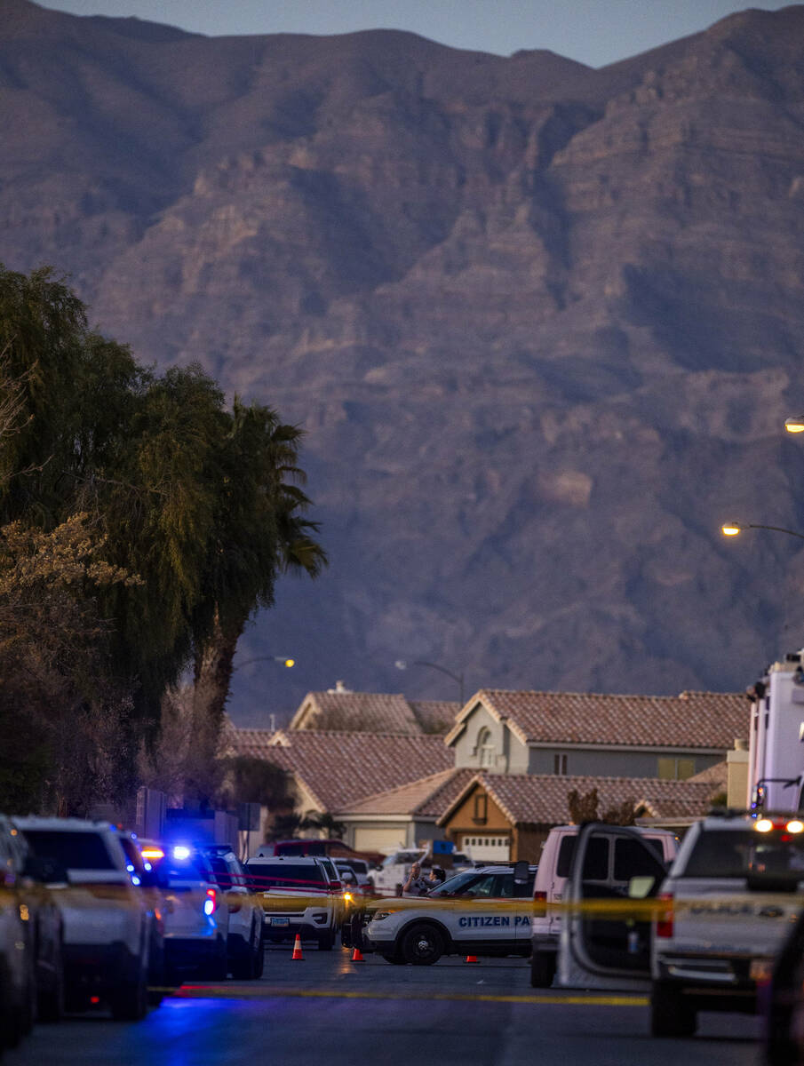 Personnel work the scene of a North Las Vegas Police officer-involved shooting along the 4700 b ...
