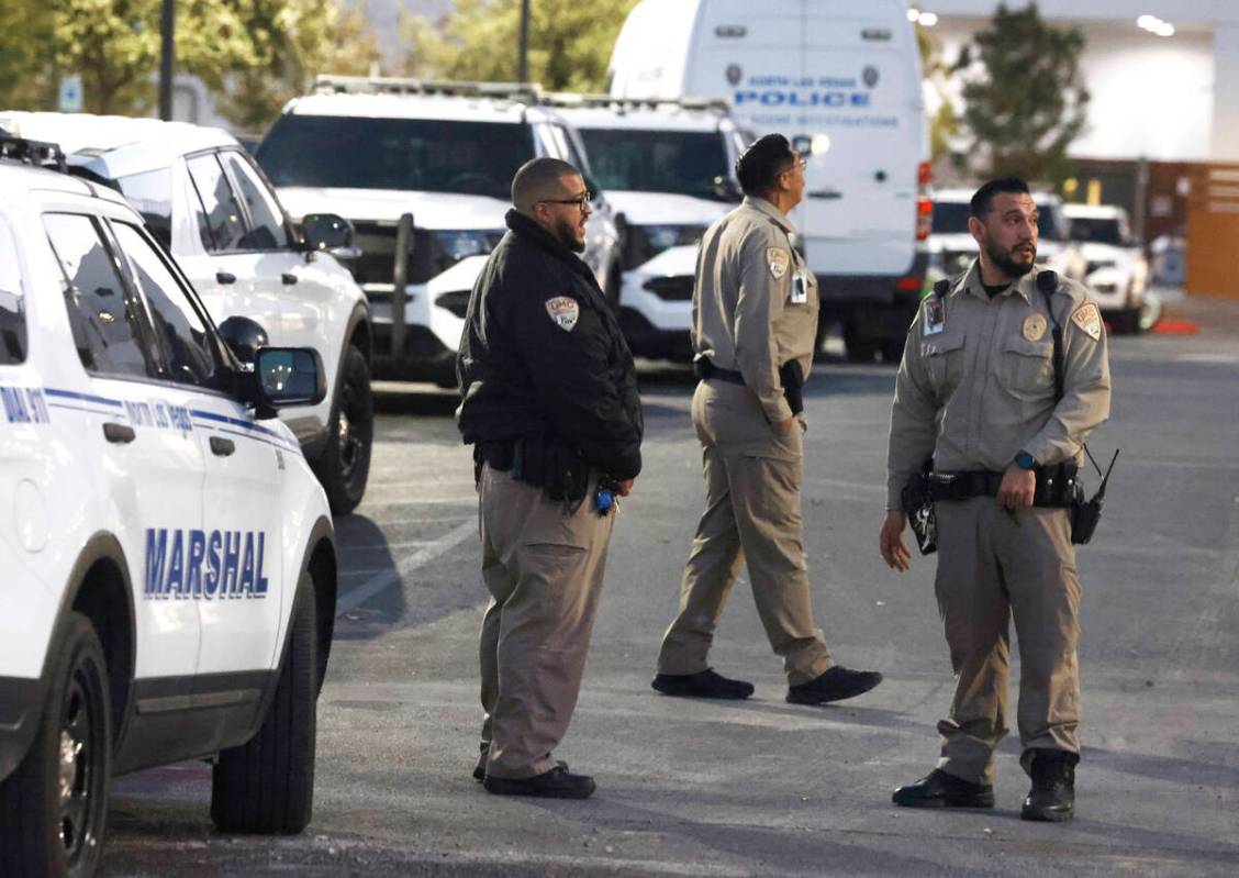 Police officers gathered outside of UMC after an officer-involved shooting near Lone Mountain R ...