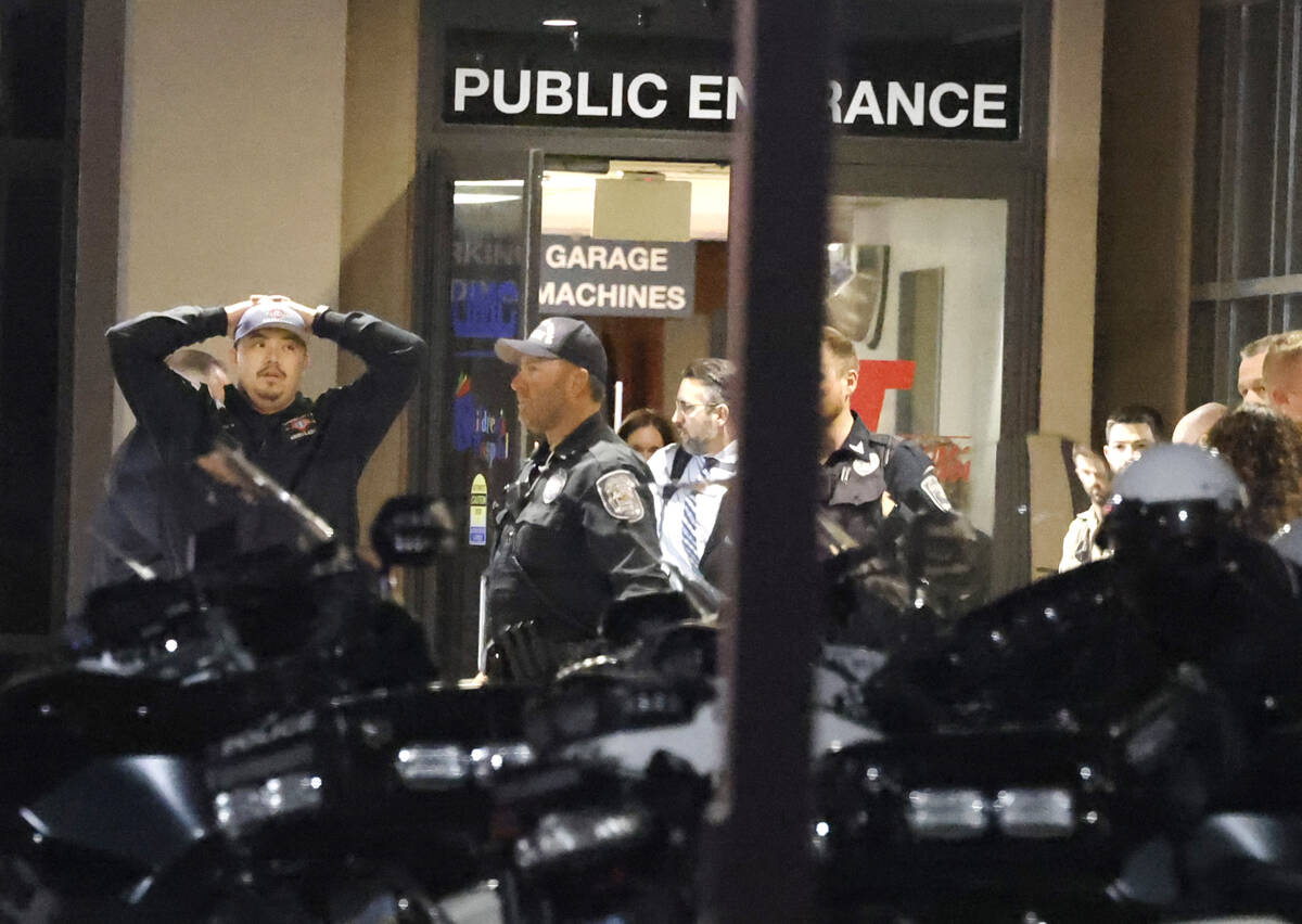 Police officers get emotional as they gathered outside of UMC where a North Las Vegas police of ...