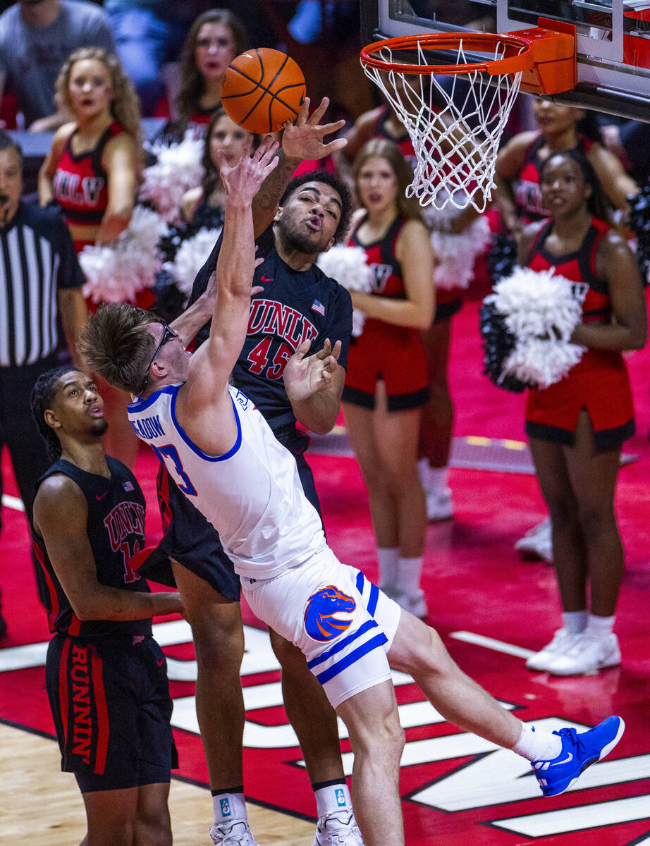 Boise State Broncos forward Andrew Meadow (13) has a ball blocked by UNLV forward Jeremiah Cher ...